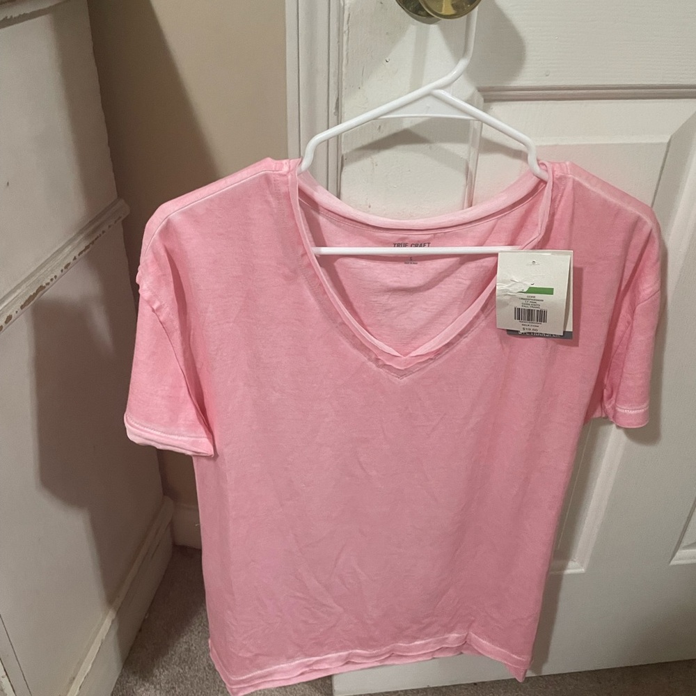 Pink short sleeve true craft T-shirt in size small but fits like a medium.